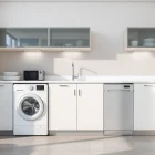 Explore бяла техника in a modern kitchen featuring well-arranged appliances for an organized cooking space.